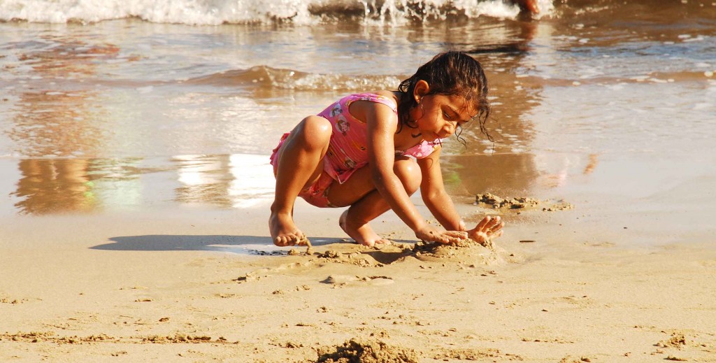 She just plays silently making mudpies along the beach of Corbyn's Cove