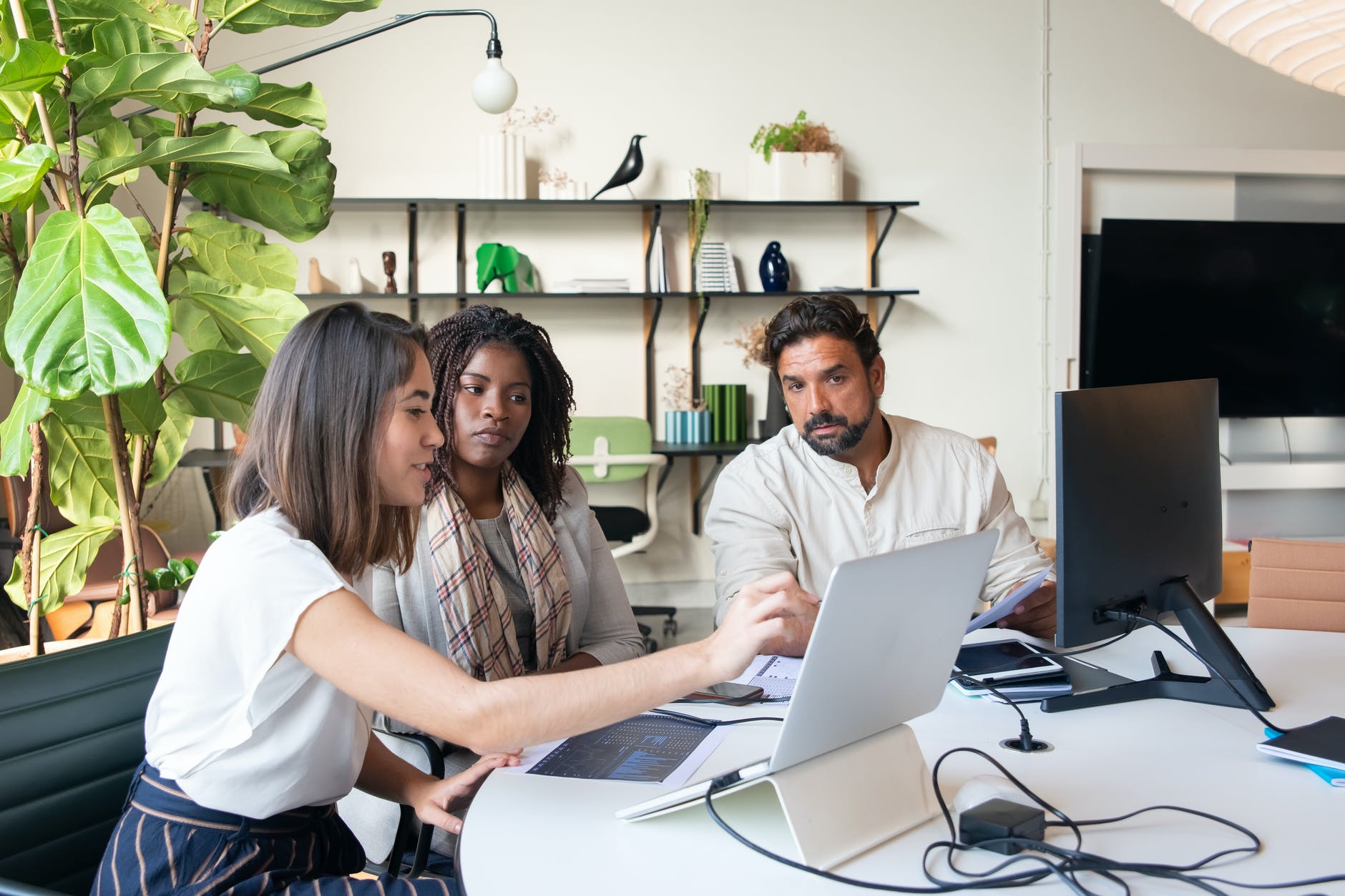 a group of people having a meeting in the office