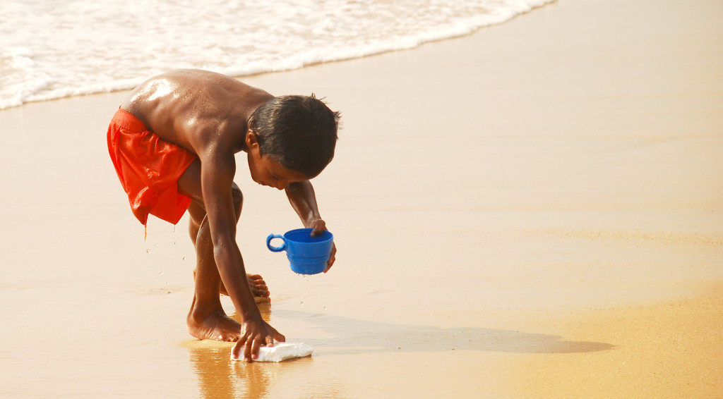 A kid runs to fetch his treasure